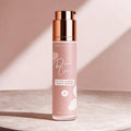 Skincare bottle labeled 'Divine Clarity' on a light background