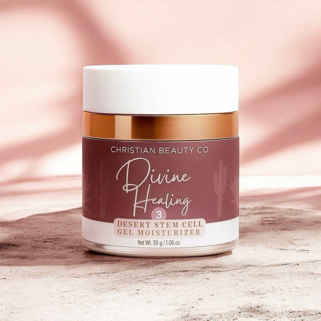 Jar of Christian Beauty Co. Divine Healing Desert Stem Cell Gel Moisturizer on a wooden surface with a pink gradient background.