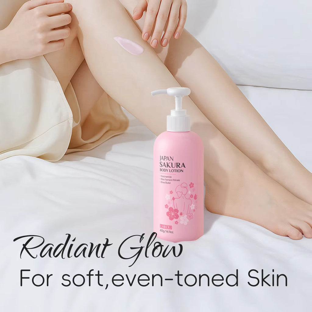 Pink bottle of Sakura body lotion with a person applying it to their leg on a white background