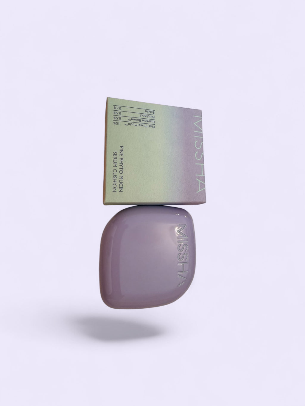 Missha Purple compact serum cushion with packaging on a white background
