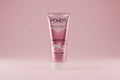 Pond's facial foam tube on a pink background