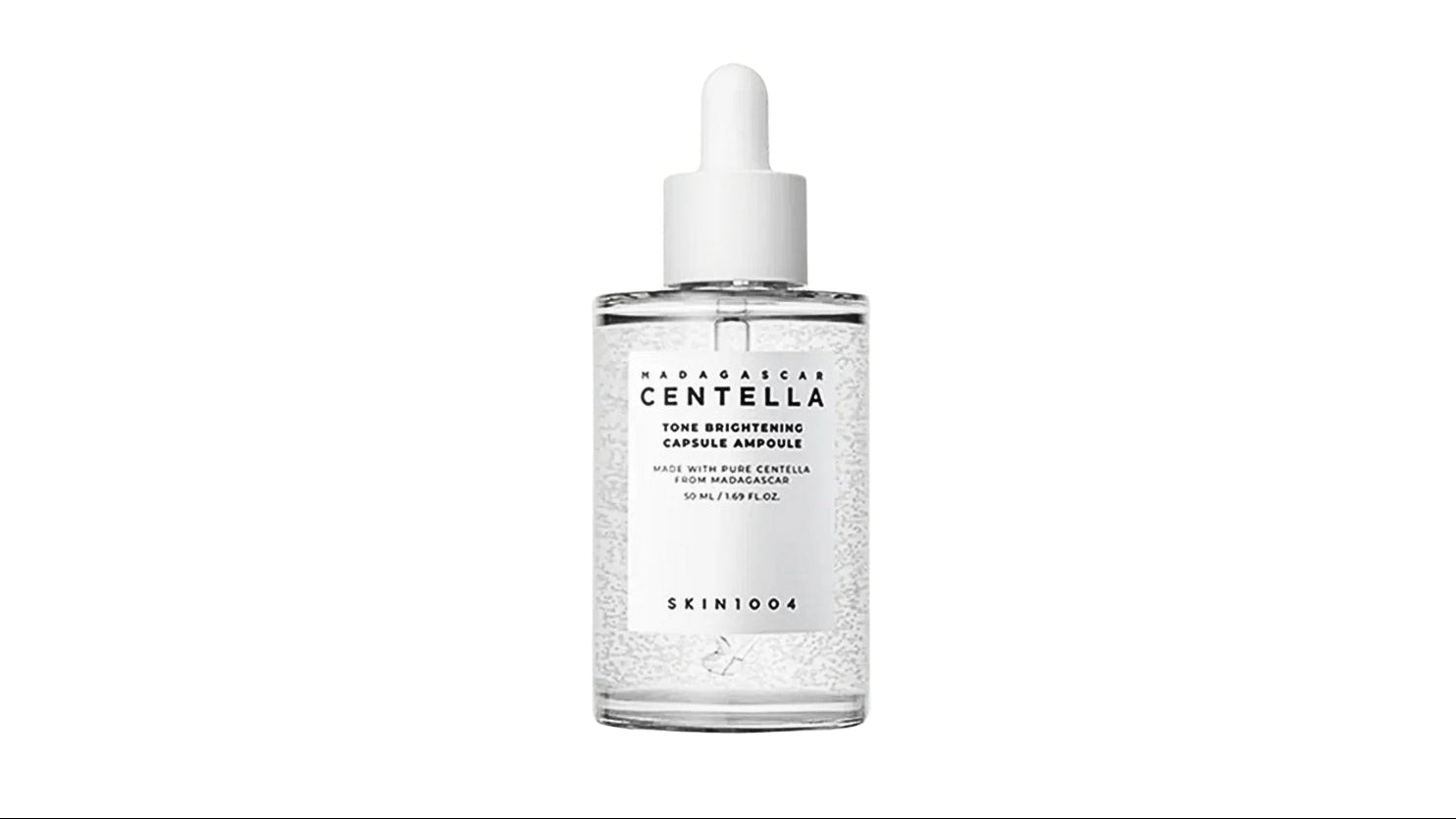 Skin 1004 Madagascar Centella tone brightening ampoule in bottle with dropper on a white background