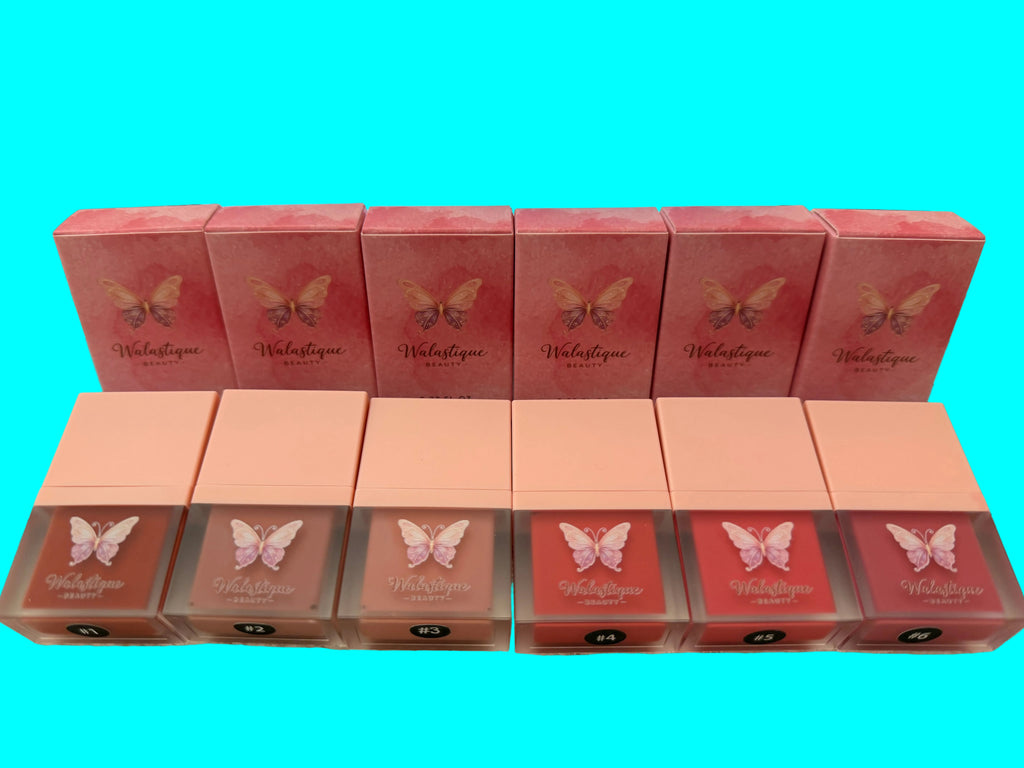 Multiple boxes of a Walastique Beauty liquid blush with butterfly design on a light blue background.