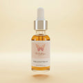 Walastique Beauty bakuchiol serum in clear glass dropper bottle on light yellow background.