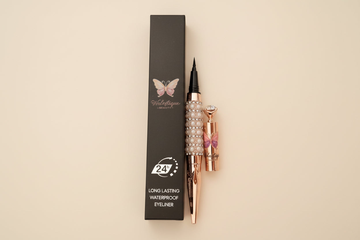 Walastique Beauty liquid eyeliner in rose gold and pearl design and black box packaging on a light background