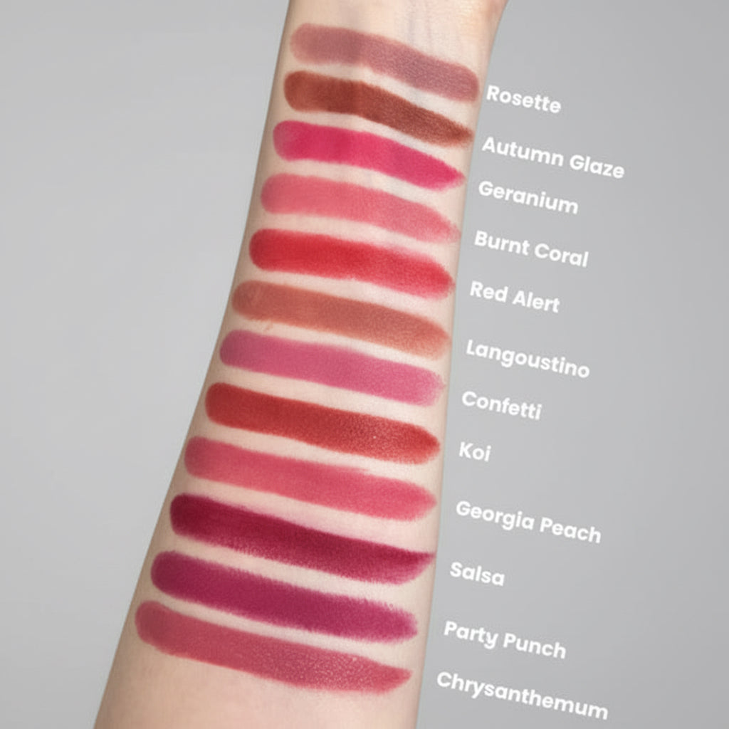 Swatches of various lipsticks on a person's arm with color names labeled.